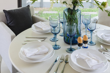 dinning room with white round tableの写真素材