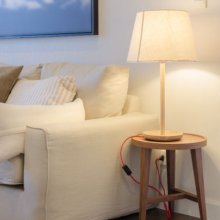 earth tone color sofa with lamp at homeの写真素材