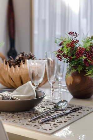 earth tone table set in dinning roomの写真素材
