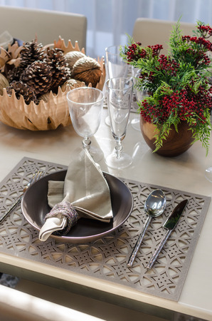 earth tone table set in dinning room at homeの写真素材