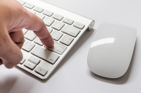 Finger pushing the button of keyboardの写真素材