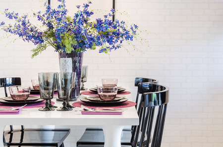 flower on white dinning table with black chair in dinning roomの写真素材