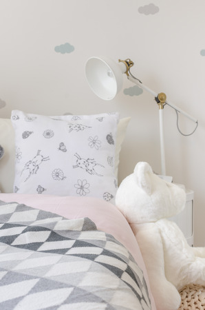 girl bedroom with doll at homeの写真素材