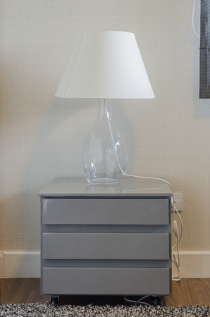 lamp on grey table in bedroom designの写真素材