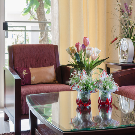 living room with red wooden sofa and chair at homeの写真素材
