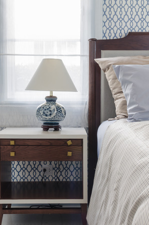 luxury bedroom with chinese style lamp on white table at homeの写真素材
