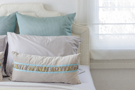 luxury bedroom with green pillowsの写真素材