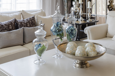 luxury earth tone living room with green leave in glass vaseの写真素材