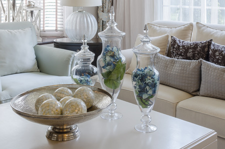 luxury earth tone living room with green leave in glass vase at homeの写真素材
