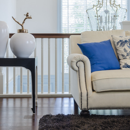 luxury living room with blue pillows on sofa at homeの写真素材