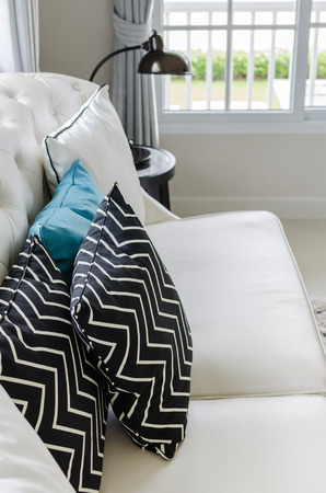 luxury white sofa in living room with row of pillows at homeの写真素材