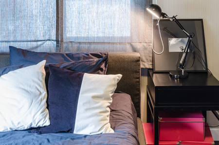 modern bedroom with black lamp on black table at homeの写真素材