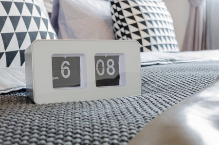 modern alarm clock on bedの写真素材