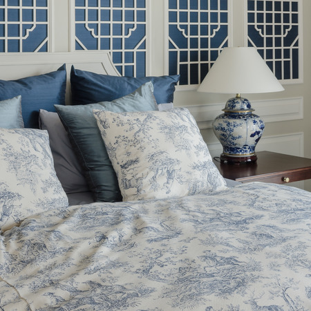 pillows on luxury king size bed in bedroomの写真素材
