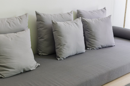 grey pillows on modern grey daybedの写真素材