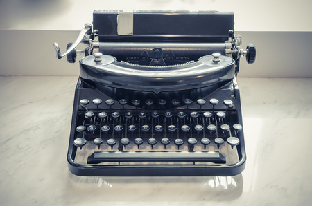 retro photo of old typewriter on tableの写真素材
