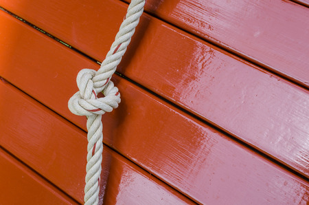 Rope knot and wood panel backgroundの写真素材