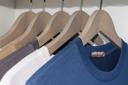 row of T shirts in wardrobeの写真素材