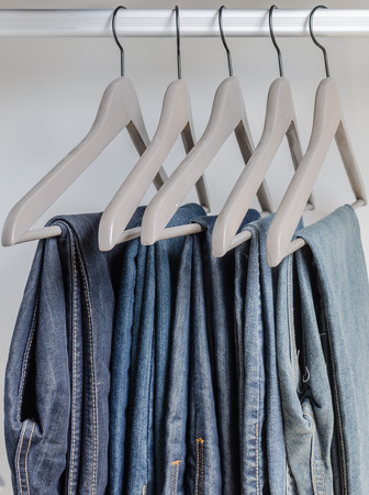 row of  jeans on hangersの写真素材