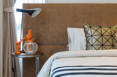 single bed with lamp in bedroom at homeの写真素材