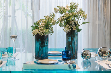 vase of flower on glass dinning table at homeの写真素材