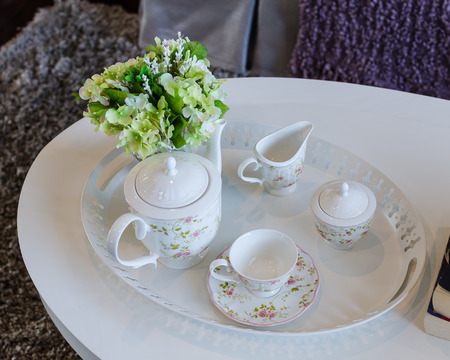 Vintage tea set on white tableの写真素材