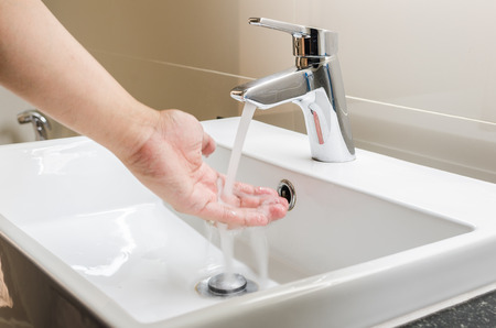 washbasin and faucet with hand washing at homeの写真素材