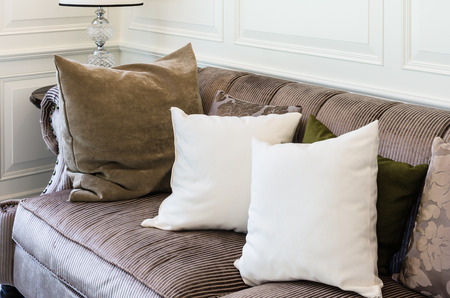 white pillows on  brown sofa in living room at homeの写真素材