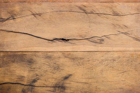 brown wood plank with gnarl as backgroundの写真素材