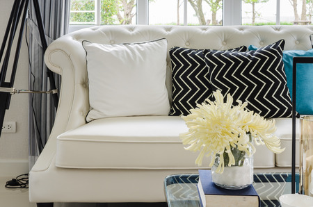 luxury white sofa in living room with yellow flower in vase at homeの写真素材