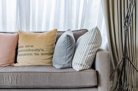 living room design with pillows on sofa at home