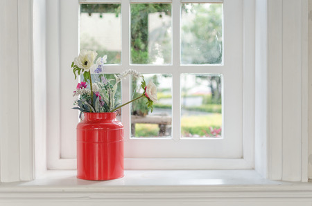 vase of flower with window frame at homeの写真素材