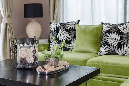 plant in vase on wooden table in living room at homeの写真素材