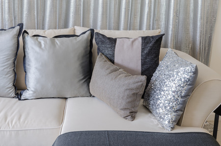 pillows on sofa with steel curtain as background at homeの写真素材