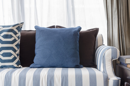 blue pillows on sofa in living room at homeの写真素材