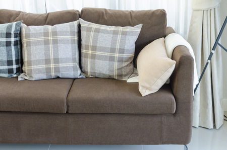 pillows on brown modern sofa in living room at homeの写真素材