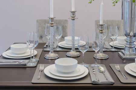 table set on wooden table in luxury dinning room at home