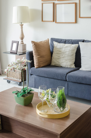 vase of plant on wooden table in living room at homeの写真素材
