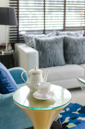 tea set cup with classic style blue chair in living roomの写真素材