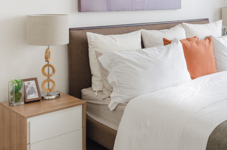 wooden lamp on woodern table in bedroom at homeの写真素材