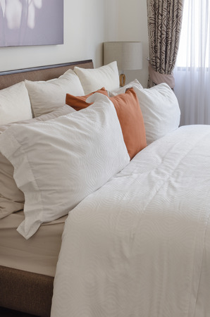 pillows on bed in modern living room at homeの写真素材