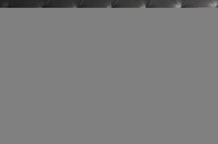 black genuine leather sofa pattern as background imageの写真素材