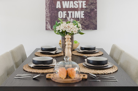 table set on wooden dinning table at homeの写真素材