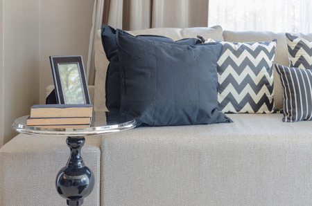 black round table in classic style with pillows and sofa at homeの写真素材