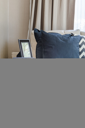black round table in classic style with pillows and sofa at homeの写真素材