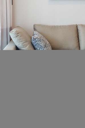 green fabric sofa with black and white pillow in living roomの写真素材