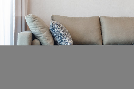 green fabric sofa with black and white pillow in living roomの写真素材