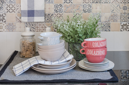 set of plates and dish on counter in kitchen room at homeの写真素材