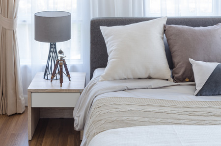 modern bedroom with lamp on white table side at homeの写真素材