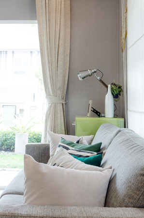 modern living room with sofa and green table side with lampの写真素材